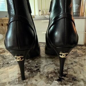 CHANEL Black Leather ankle Boots with Gold Accents